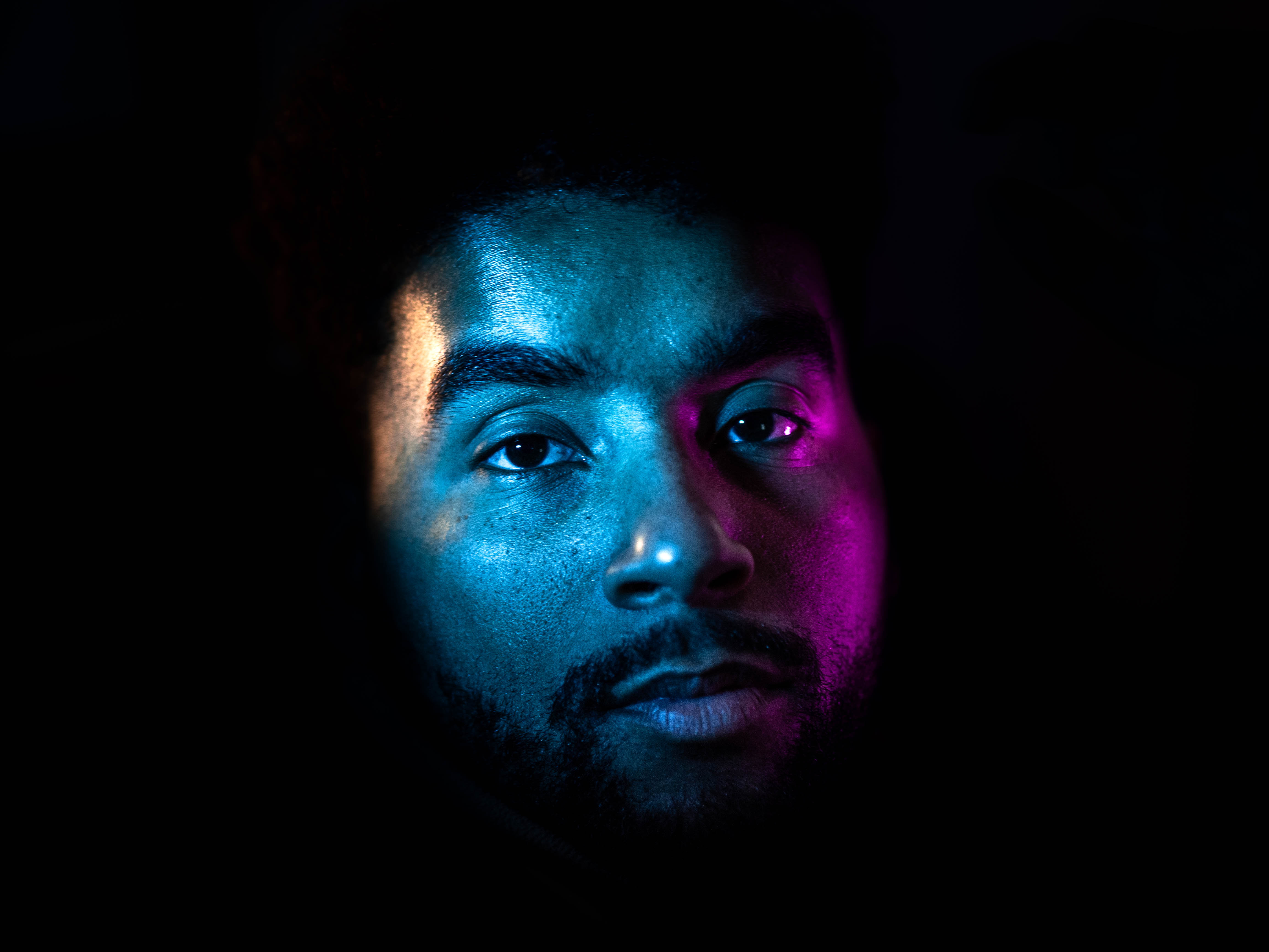 Close-up of APXO lit with blue and magenta neon light