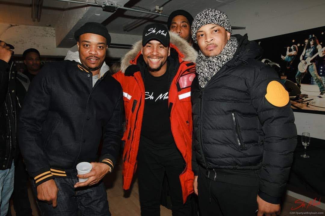 APXO backstage at a Montreal show standing with T.I.